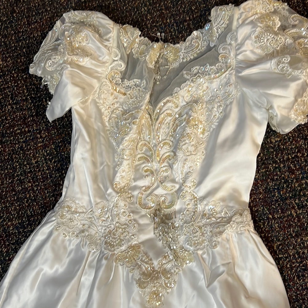 Custom MadeHigh End Wedding Dress with Emerald beads long tail that flairs out